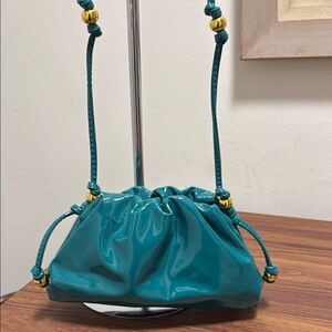 NWOT Cloud Pleated Mini Cross Body Bag in Teal Blue Patent Leather/Gold Bead.